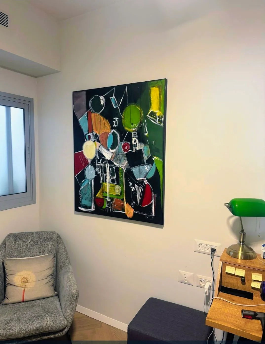 A Paula Harmsen painting living in a styled corner of a home